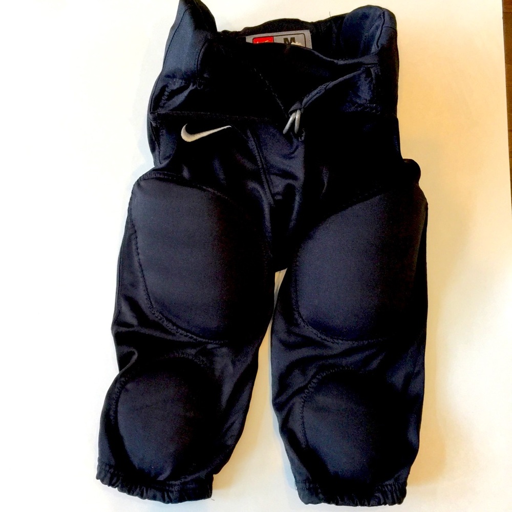Nike size Medium boys padded football pants 100% polyester